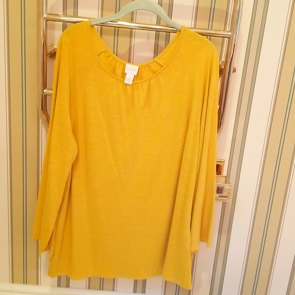 Blouse with bell sleeves and slits at bottom of sleeves
